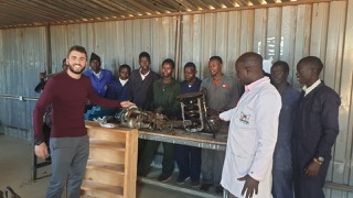 Volunteer Nikos with automotive students