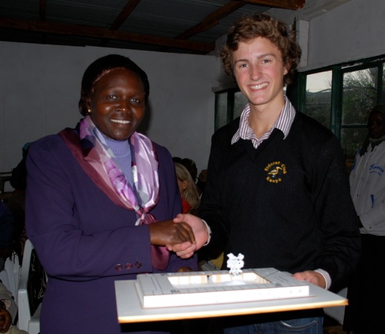 volunteer Christopher presenting school model