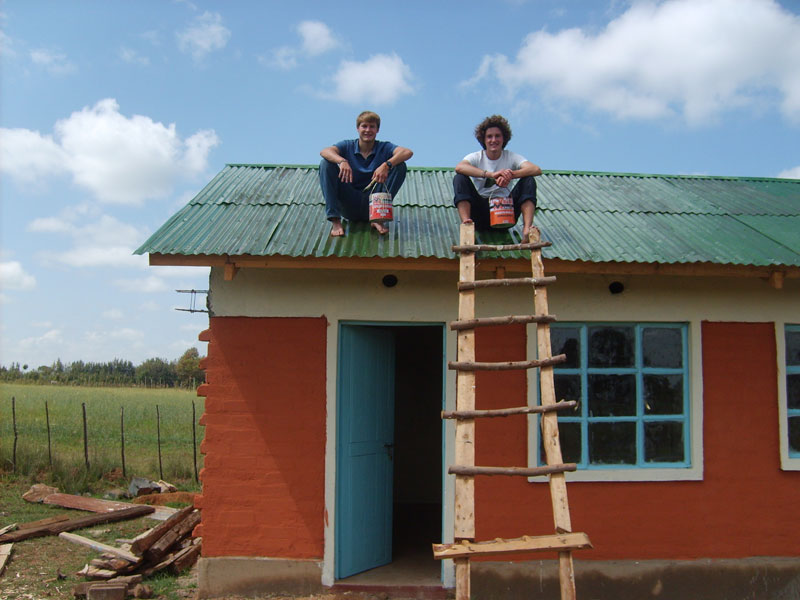 volunteer William Christopher on new school house roof